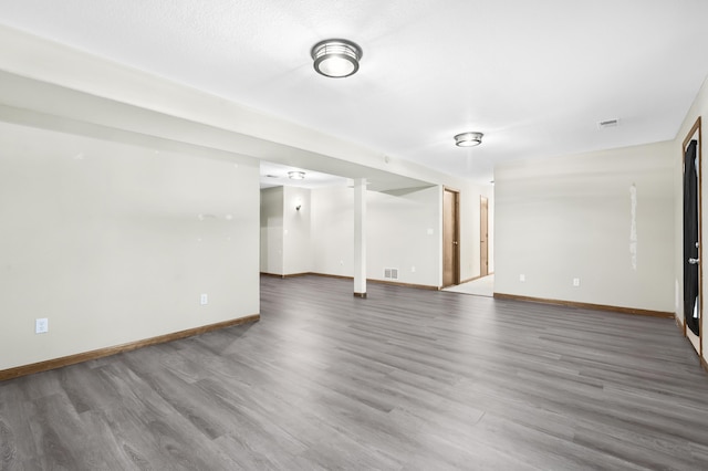 408 Meadowlark Rd, Branson West, MO 65737 - unfurnished living room featuring baseboards, visible vents, and wood finished floors