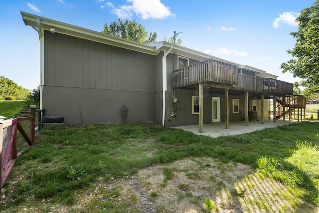 408 Meadowlark Rd, Branson West, MO 65737 - back of house featuring a deck, fence, a patio area, stairway, and a lawn