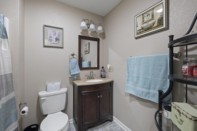 full bathroom with toilet, baseboards, tile patterned floors, and vanity