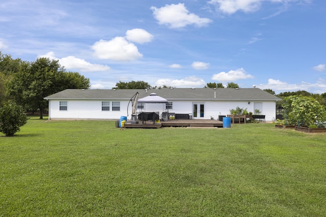 back of house with a yard, a gazebo, a wooden deck, and french doors