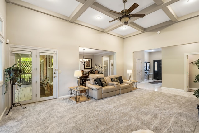 carpeted living room featuring coffered ceiling, baseboards, a high ceiling, a ceiling fan, and french doors