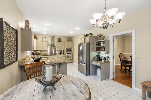 dining area featuring a chandelier, light tile patterned floors, recessed lighting, and baseboards