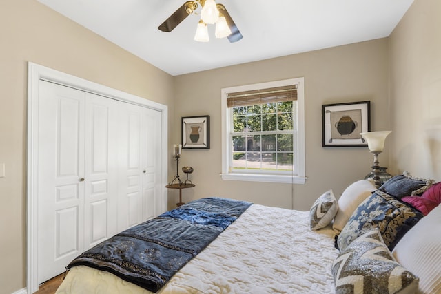 bedroom with a closet, a ceiling fan, and wood finished floors