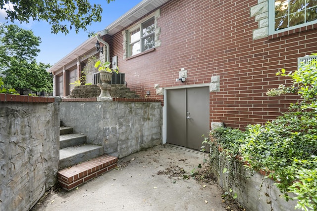 view of side of home featuring brick siding