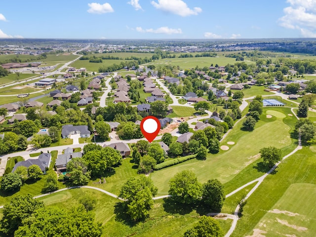 aerial view of residential area featuring a local golf course