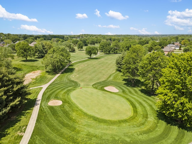 bird's eye view of a golf club and a tree filled landscape
