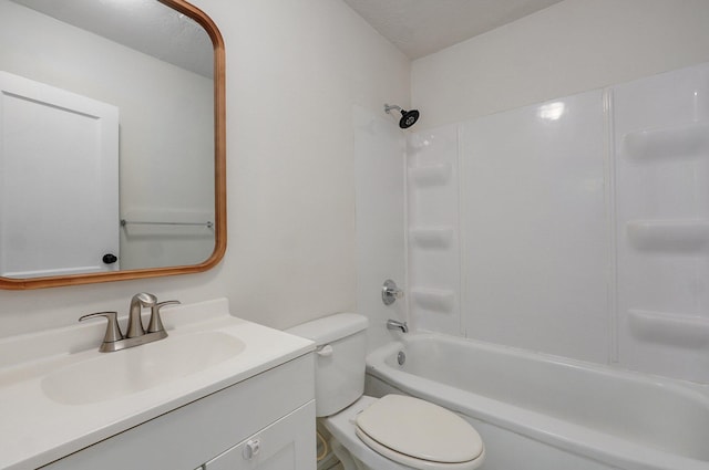 bathroom featuring vanity, toilet, and bathing tub / shower combination