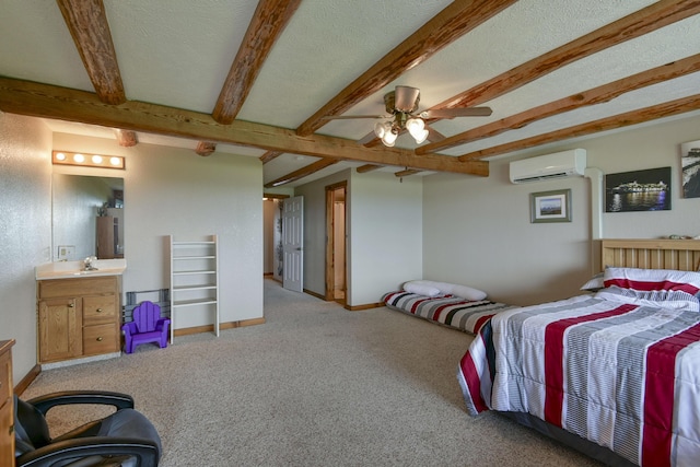 carpeted bedroom featuring a sink, an AC wall unit, baseboards, and beam ceiling