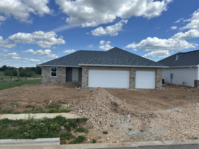 1324 N Maxine Ave, Nixa, MO 65714 - ranch-style house featuring dirt driveway, a shingled roof, and a garage