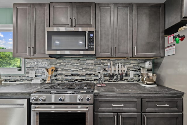 kitchen featuring stainless steel appliances and tasteful backsplash