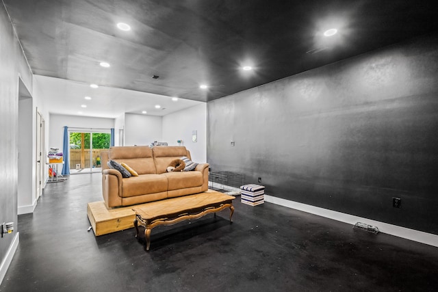 living room with recessed lighting and baseboards