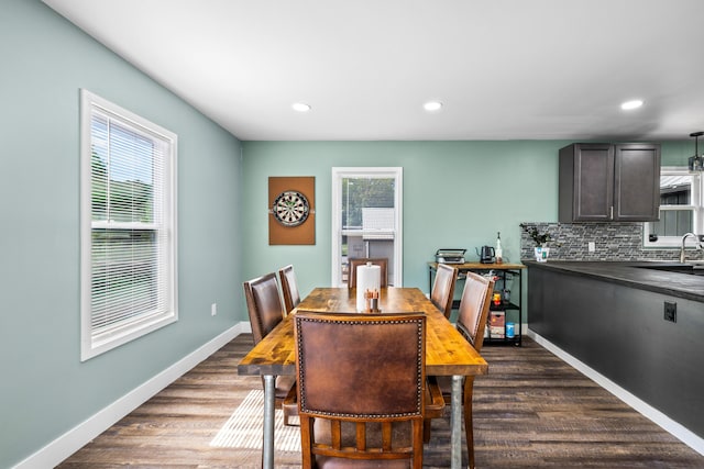 dining area featuring dark wood-type flooring, recessed lighting, and baseboards