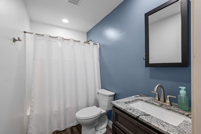 bathroom featuring toilet, vanity, curtained shower, wood finished floors, and recessed lighting