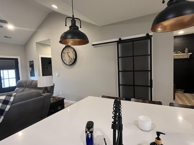 detailed view of a barn door and pendant lighting