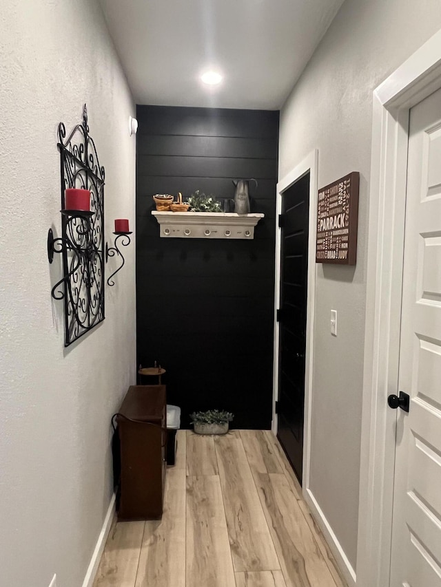 hallway featuring light wood-style flooring