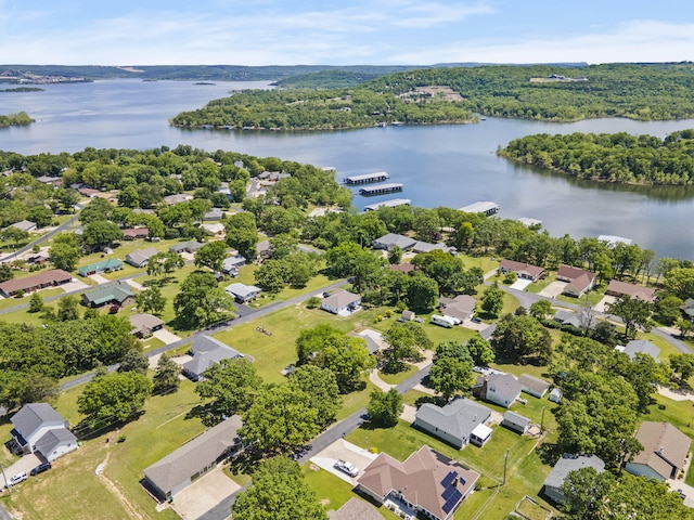 aerial view of residential area featuring a nearby body of water