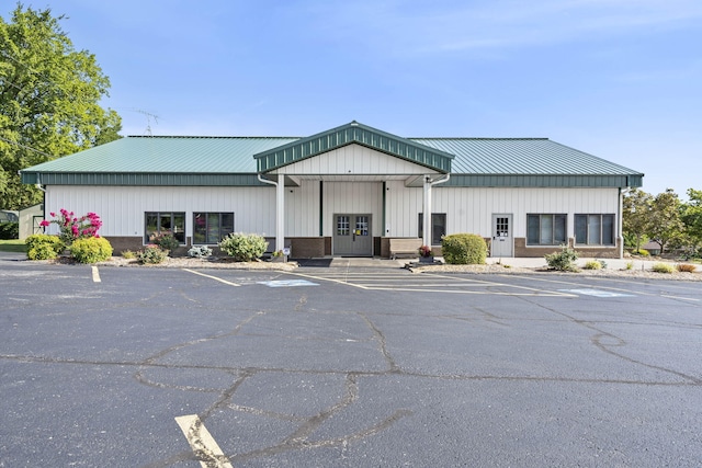 view of building exterior featuring uncovered parking