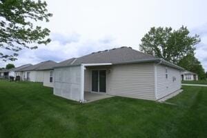 back of property with a yard