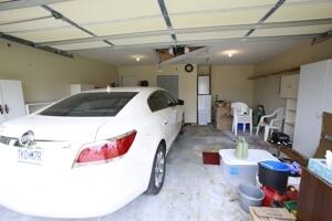 garage with freestanding refrigerator