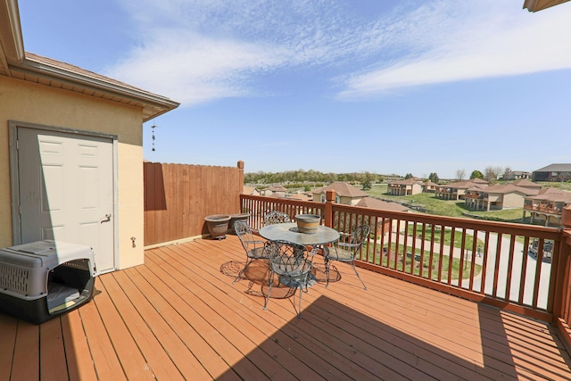 134 Monte Christo Dr, Hollister, MO 65672 - wooden deck featuring a residential view and outdoor dining space