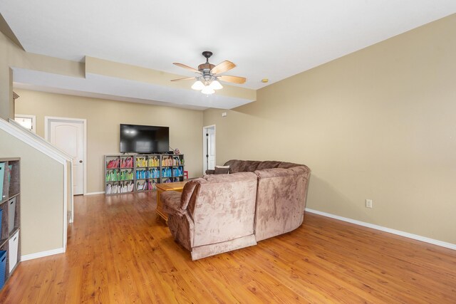 12048 N Farm Road 93, Walnut Grove, MO 65770 - living area with a ceiling fan, light wood-style flooring, and baseboards