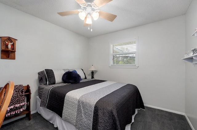 bedroom with dark carpet, ceiling fan, and baseboards