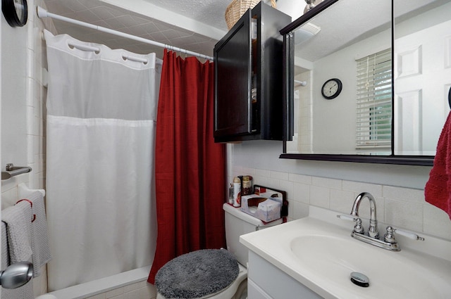bathroom with curtained shower, vanity, toilet, and tile walls