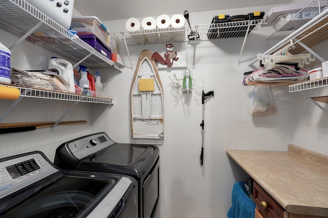 washroom featuring washer and clothes dryer