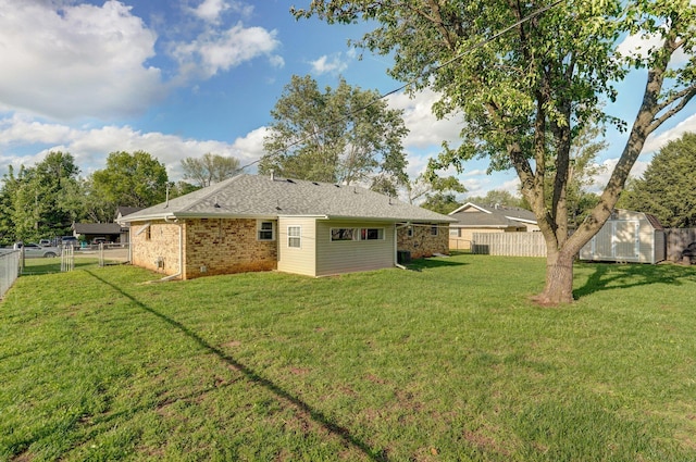 back of house featuring a storage shed, an outbuilding, and brick siding