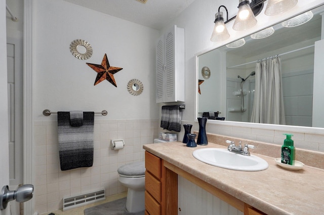full bathroom with toilet, tile walls, vanity, and curtained shower