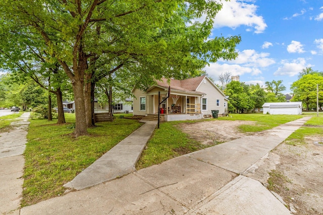 bungalow-style house featuring a porch and a front lawn