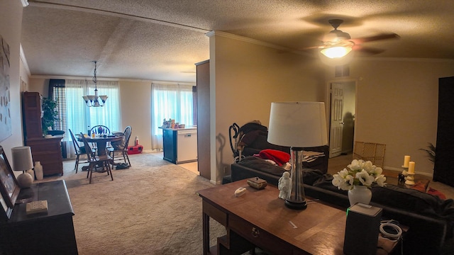 1156 SE 180th Rd, Clinton, MO 64735 - living room with crown molding, light carpet, a textured ceiling, a ceiling fan, and a chandelier
