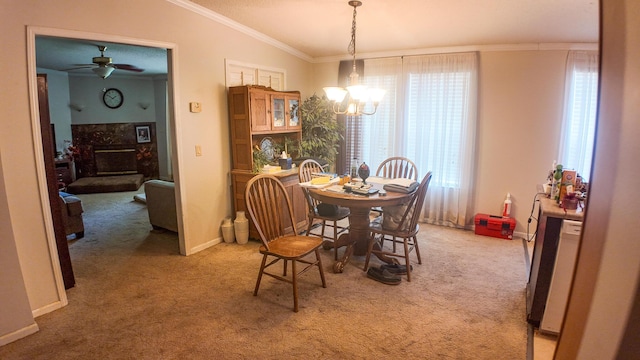 1156 SE 180th Rd, Clinton, MO 64735 - dining space featuring ornamental molding, light colored carpet, a chandelier, a ceiling fan, and baseboards
