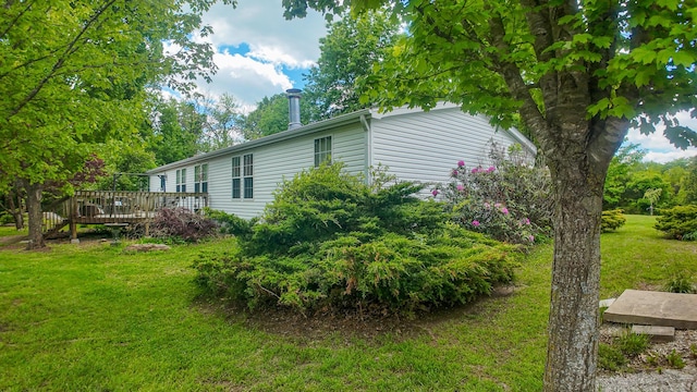 1156 SE 180th Rd, Clinton, MO 64735 - view of home's exterior featuring a wooden deck and a yard