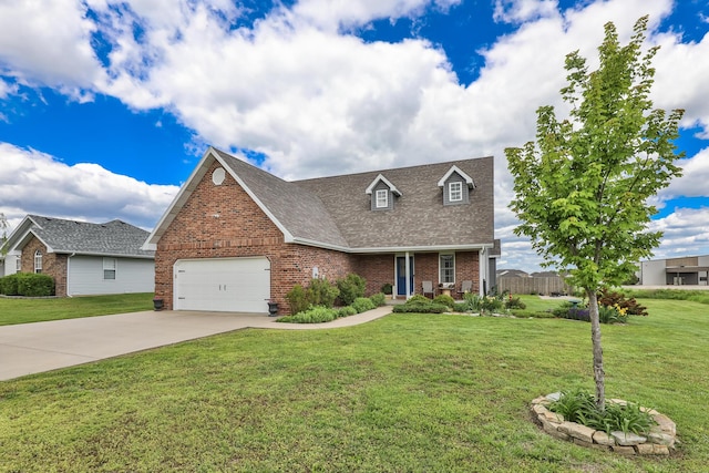 view of front of house with brick siding, an attached garage, concrete driveway, and a front lawn