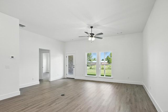 1707 E White Oak Dr, Joplin, MO 64801 - unfurnished living room with a ceiling fan and wood finished floors