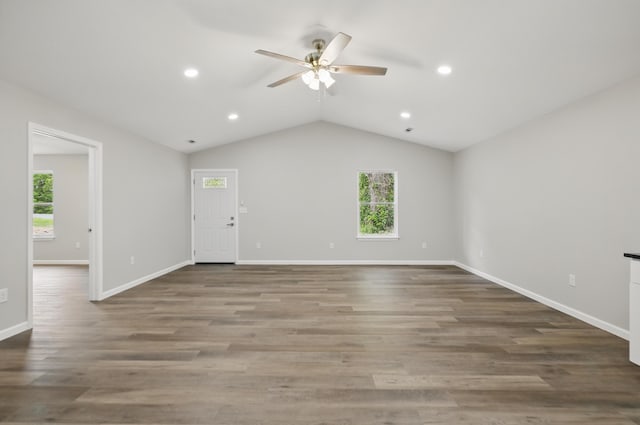 unfurnished living room featuring a ceiling fan, plenty of natural light, recessed lighting, baseboards, and vaulted ceiling