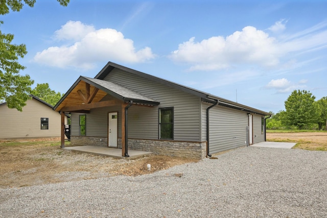 view of front of home featuring stone siding
