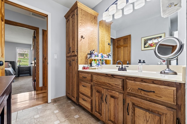 bathroom with vanity and baseboards