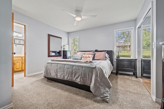 carpeted bedroom with baseboards and ceiling fan