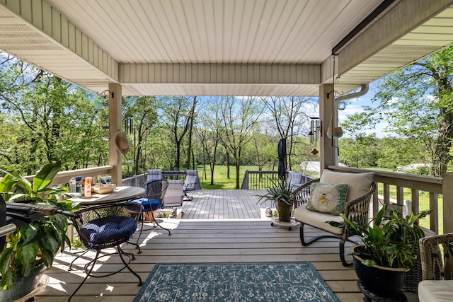 wooden deck with outdoor dining area