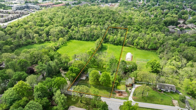 view of property location with property parcel outlined and a forest