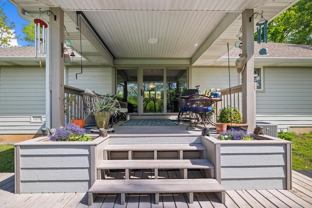 wooden terrace featuring cooling unit