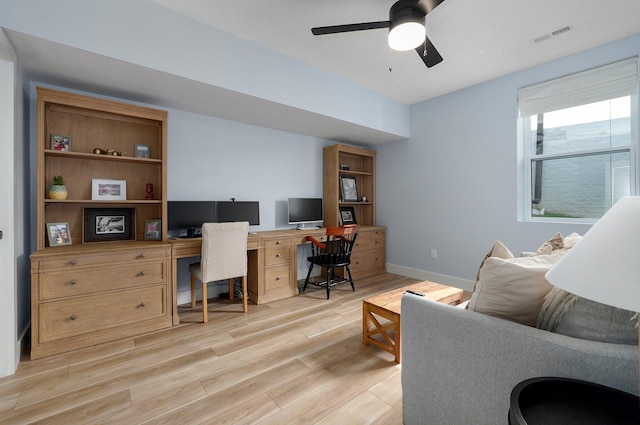 office with light wood-type flooring, ceiling fan, and baseboards