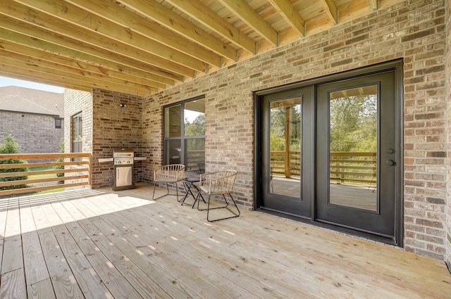 wooden deck with area for grilling