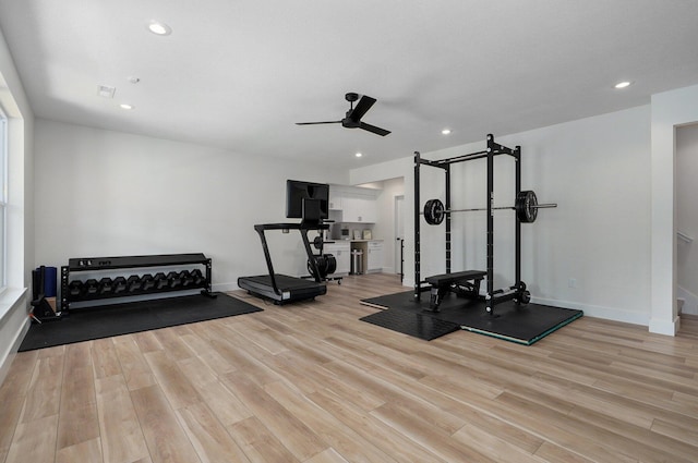workout area featuring wood finished floors, ceiling fan, baseboards, and recessed lighting