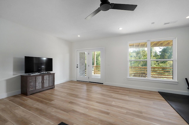 unfurnished living room with ceiling fan, light wood-type flooring, baseboards, and recessed lighting