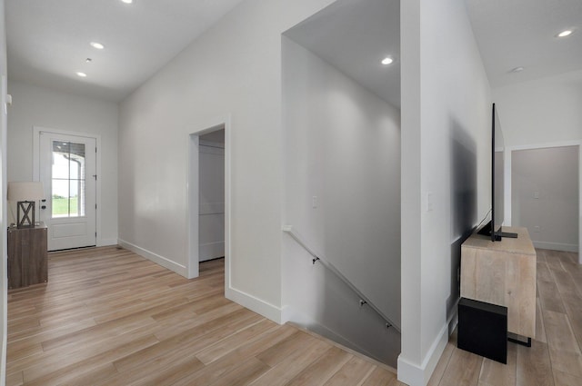 entrance foyer featuring light wood-style floors, baseboards, and recessed lighting