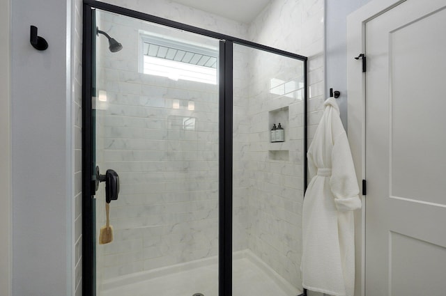 bathroom featuring a shower stall