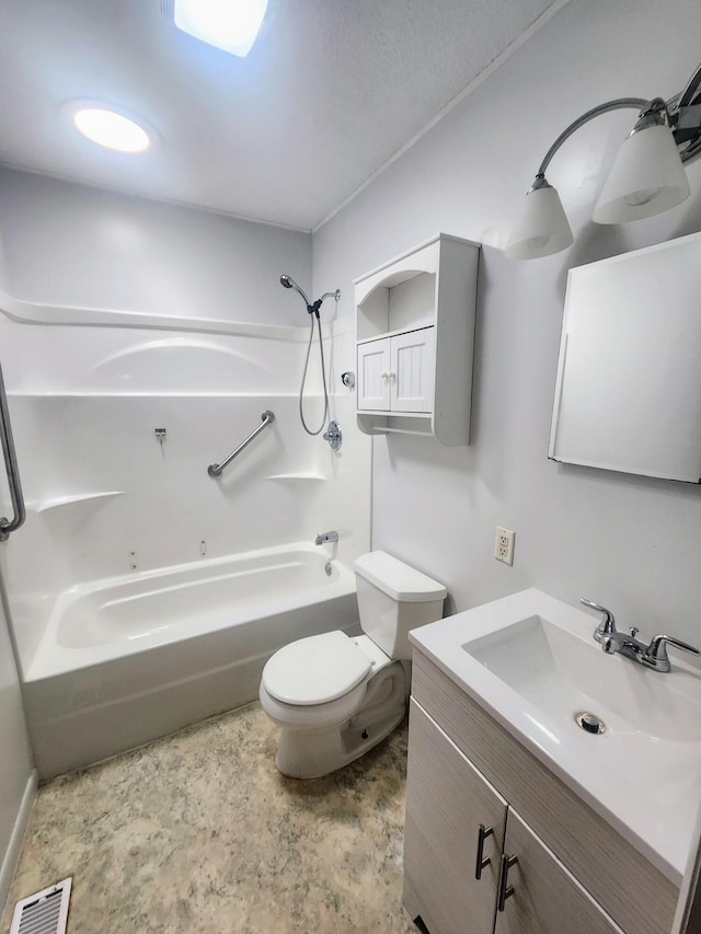 bathroom with bathing tub / shower combination, toilet, and vanity
